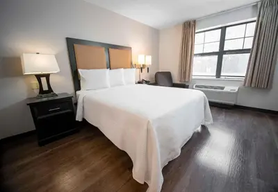 a bedroom with a large white bed and a window at Extended Stay America Suites - Los Angeles - Torrance - Del Amo Circle in Torrance