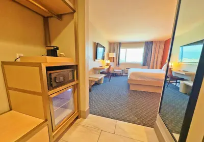 a hotel room with a bedroom with a bed at Lincoln Hotel Monterey Park Los Angeles in Monterey Park
