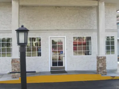 a street light in front of a building at Motel 6-Anaheim, CA in Anaheim