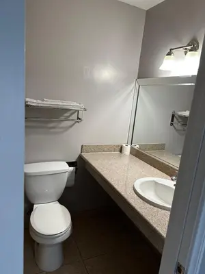 a bathroom with a toilet and a sink at Vegas motel in West Athens