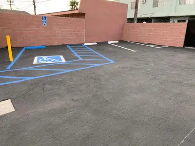 a parking lot with blue drawings on it at Vegas motel in West Athens