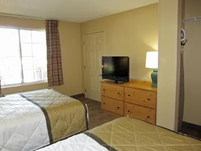 a bedroom with a bed and a tv on a dresser at Extended Stay America Suites - Los Angeles - LAX Airport - El Segundo in El Segundo