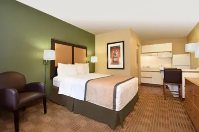 a hotel room with a bed and a desk and a chair at Extended Stay America Suites - Los Angeles - LAX Airport - El Segundo in El Segundo