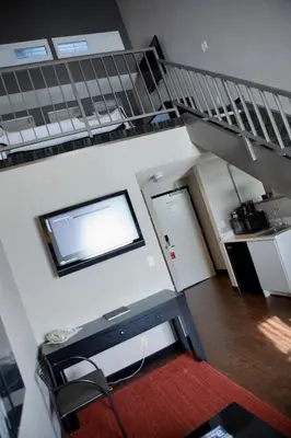a room with a staircase and a stair case at Ramada Plaza by Wyndham West Hollywood Hotel & Suites in Los Angeles