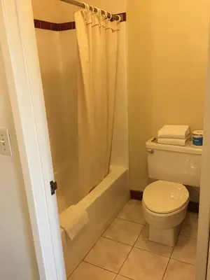 a bathroom with a toilet and a shower at Grand Inn\u8ca1\u795e\u5ba2\u68e7 in Monterey Park