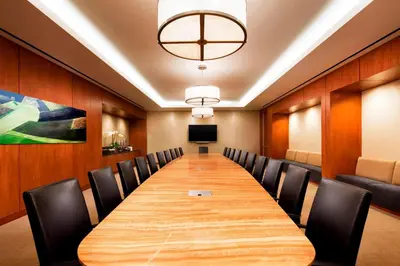 a conference room with a long table and chairs at Sheraton Fairplex Suites & Conference Center in Pomona