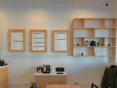 a room with wooden shelves and a table and a counter at Hometel Suites in Los Angeles