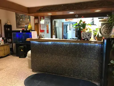 a bar in a room with a counter with plants at King Lodge Motel in Monterey Park