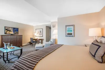 a hotel room with a bed and a living room at Omni Los Angeles Hotel in Los Angeles