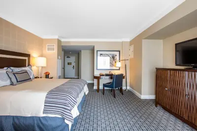 a hotel room with a bed and a flat screen tv at Omni Los Angeles Hotel in Los Angeles