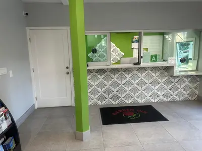 a room with a green pole and a tile wall at Garden Inn San Gabriel in San Gabriel