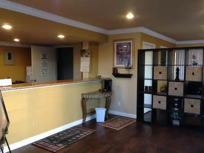 a bar in a room with a counter at Fullerton Inn in Fullerton