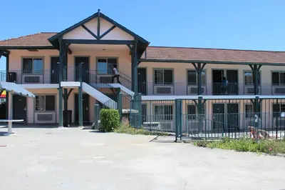 a building with a staircase in front of it at Best Whittier Inn in Whittier