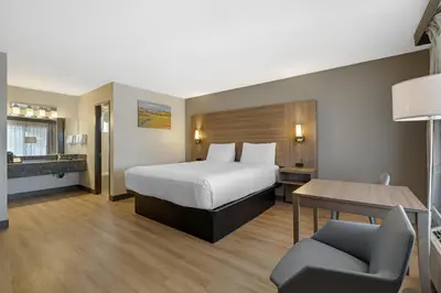 a hotel room with a bed and a desk at Best Western La Posada Motel in Fillmore