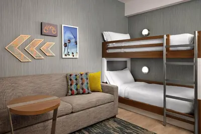 a living room with a couch and bunk beds at Element Anaheim Resort Convention Center in Anaheim