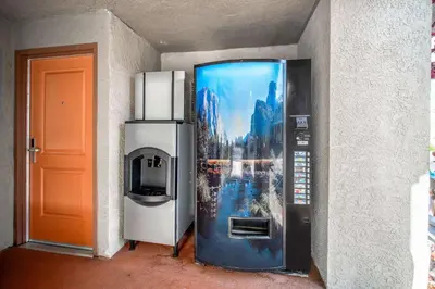 a refrigerator with a picture on the side of a wall at Rodeway Inn South Gate - Los Angeles South in South Gate