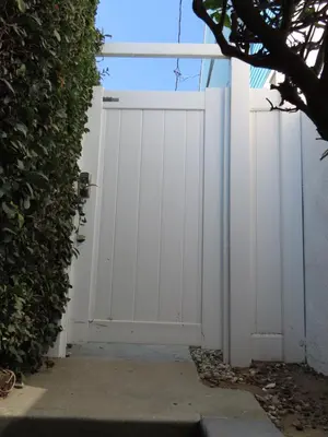 a white garage door in front of a building at Hill Street Cottage in Los Angeles