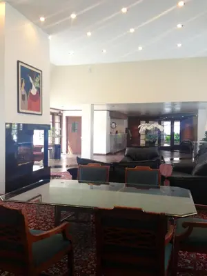 a living room with a table and a couch at Mikado Hotel in North Hollywood