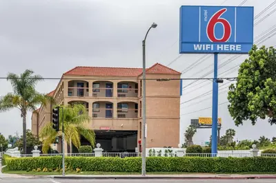 a building with a sign in front of it at Motel 6-Gardena, CA - South in Gardena