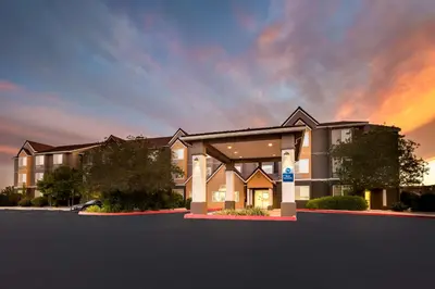 a rendering of a large house with a sunset at Best Western California City Inn & Suites in California City