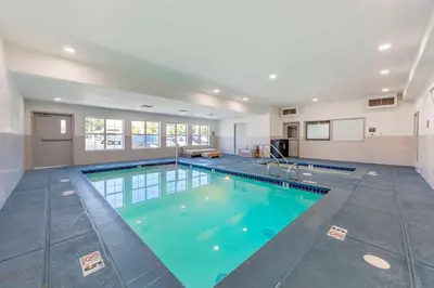 a large swimming pool in a house at Executive Residency by Best Western Victorville in Victorville