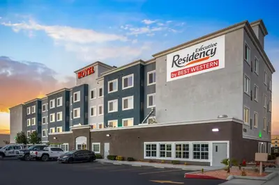 a hotel with a sign on the side of a building at Executive Residency by Best Western Victorville in Victorville