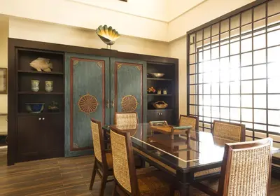 a dining room with a glass table and chairs at Ayres Hotel Orange in Anaheim