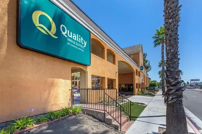a building with a sign on the side of it at Quality Inn & Suites Westminster Seal Beach in Westminster
