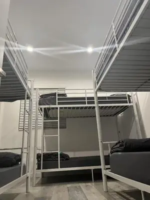 a couple of bunk beds in a room at Modern Hostel address changed in Los Angeles