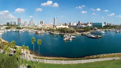 an aerial view of a harbor with boats in a city at Mid-Mod Retro Private Studio & Pool in Long Beach