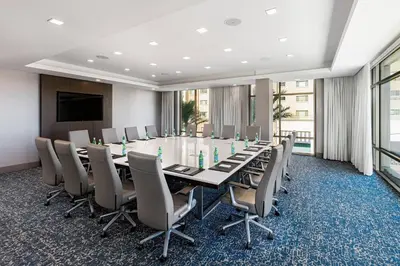 a conference room with a long table and chairs at Courtyard by Marriott Los Angeles Monterey Park in Monterey Park