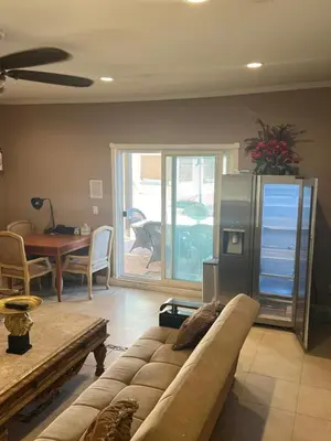a living room with a couch and a table at paradise luxury experience in Woodland Hills