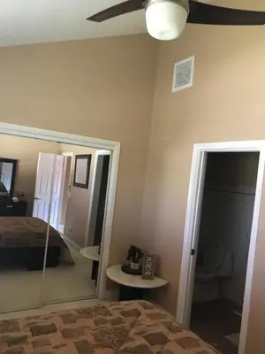 a bedroom with a bed and a ceiling fan at paradise luxury experience in Woodland Hills