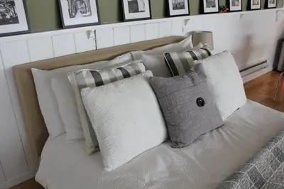 a white couch with a bunch of pillows on it at Private Guest Suite in West Los Angeles in Los Angeles