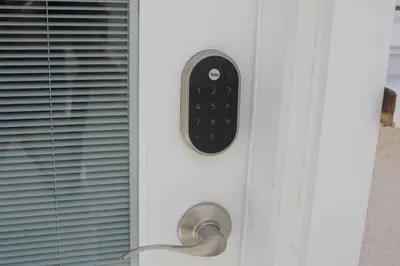 a door with a remote control on it at Private Guest Suite in West Los Angeles in Los Angeles