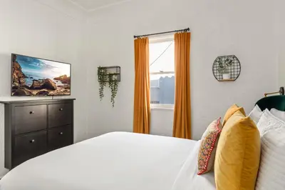 a bedroom with a bed and a window at Visit the Beach from a Historic Downtown Apartment - NRP21-00092 in Long Beach