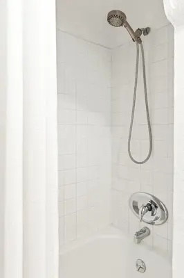 a shower with a shower head in a bathroom at Visit the Beach from a Historic Downtown Apartment - NRP21-00092 in Long Beach