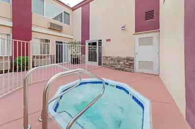 a hot tub on the balcony of a building at Best Western Canoga Park Motor Inn in Canoga Park