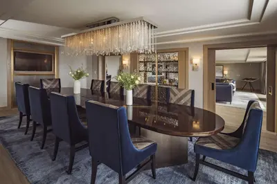 a dining room with a table and chairs at L'Ermitage Beverly Hills in Los Angeles