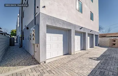two garage doors on the side of a building at Green HomeStay address changed in Los Angeles