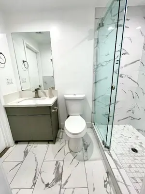 a bathroom with a toilet and a sink and a shower at Green HomeStay address changed in Los Angeles