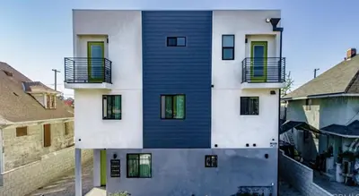 a house with a blue and white facade at Green HomeStay address changed in Los Angeles