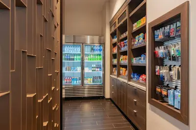 a hallway with a refrigerator filled with drinks at Courtyard by Marriott Thousand Oaks Agoura Hills in Agoura Hills