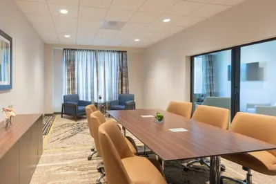 a conference room with a table and chairs at Courtyard by Marriott Thousand Oaks Agoura Hills in Agoura Hills