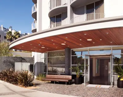 a building with a bench in front of it at Hotel Angeleno in Los Angeles
