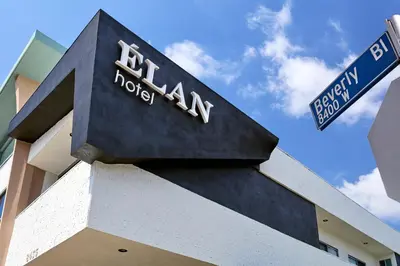 a sign on the side of a building at Elan Hotel in Los Angeles