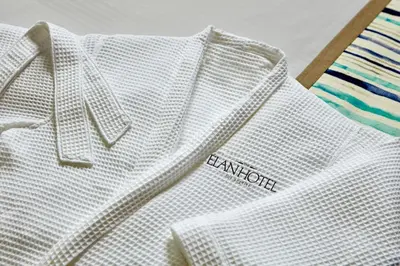 a white shirt with the word cambridge on it at Elan Hotel in Los Angeles
