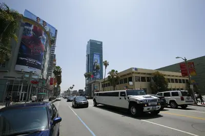 a busy city street with cars and a white truck at Hollywood Guest Inn in Los Angeles