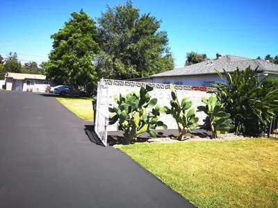 a house with a sign on the side of a driveway at Pasadena single house 3b1b \u4e09\u623f\u4e00\u5385\u4e00\u53a8\u4e00\u6d74 in Pasadena