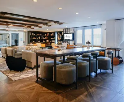 a large living room with a large table and chairs at Hotel Amarano Burbank-Hollywood in Burbank